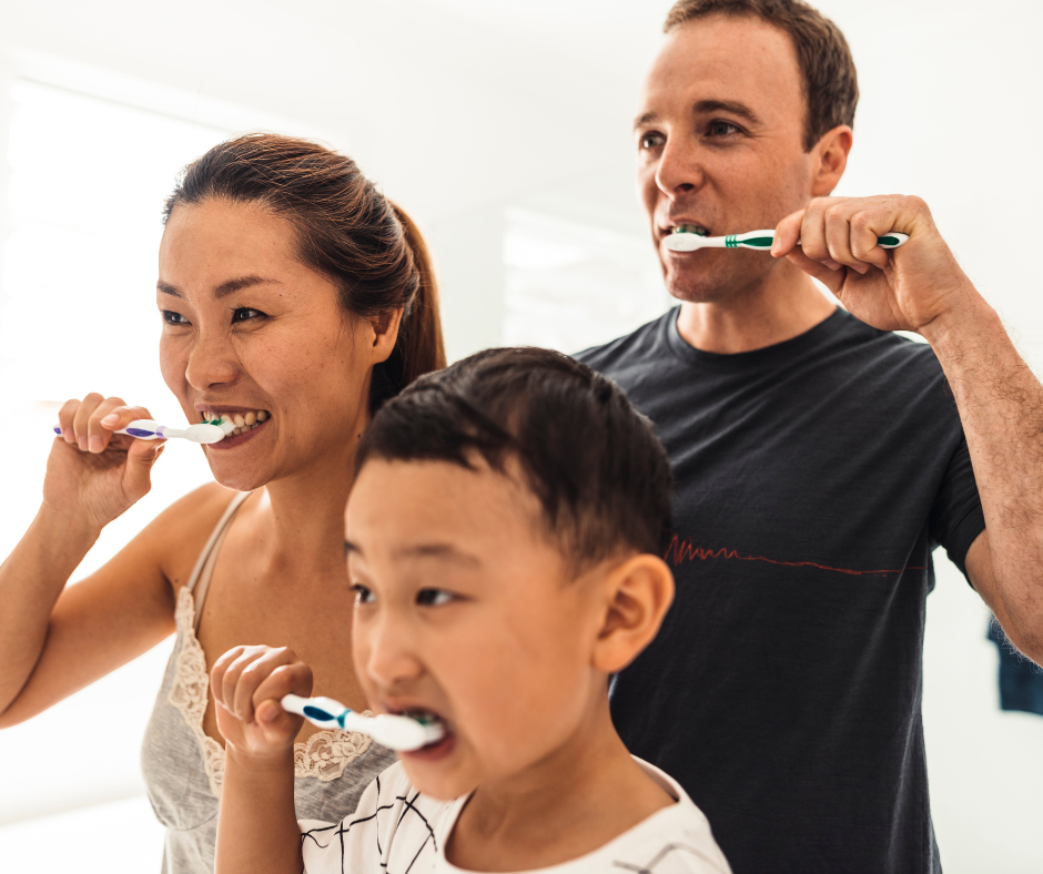 Family brushing teeth together. Advice given by vancouver's best dentist broadway smiles.
